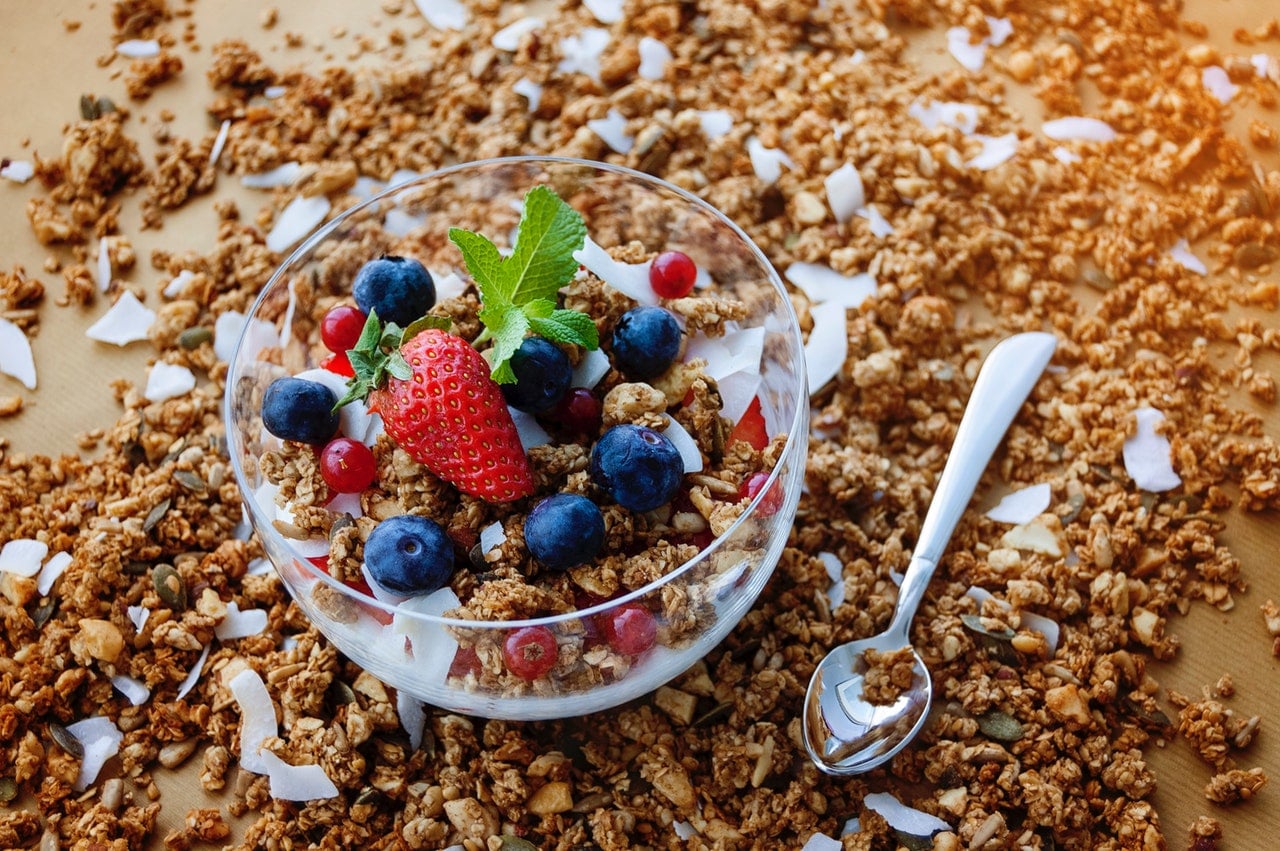 oats with straberry and blueberries in a clear glass